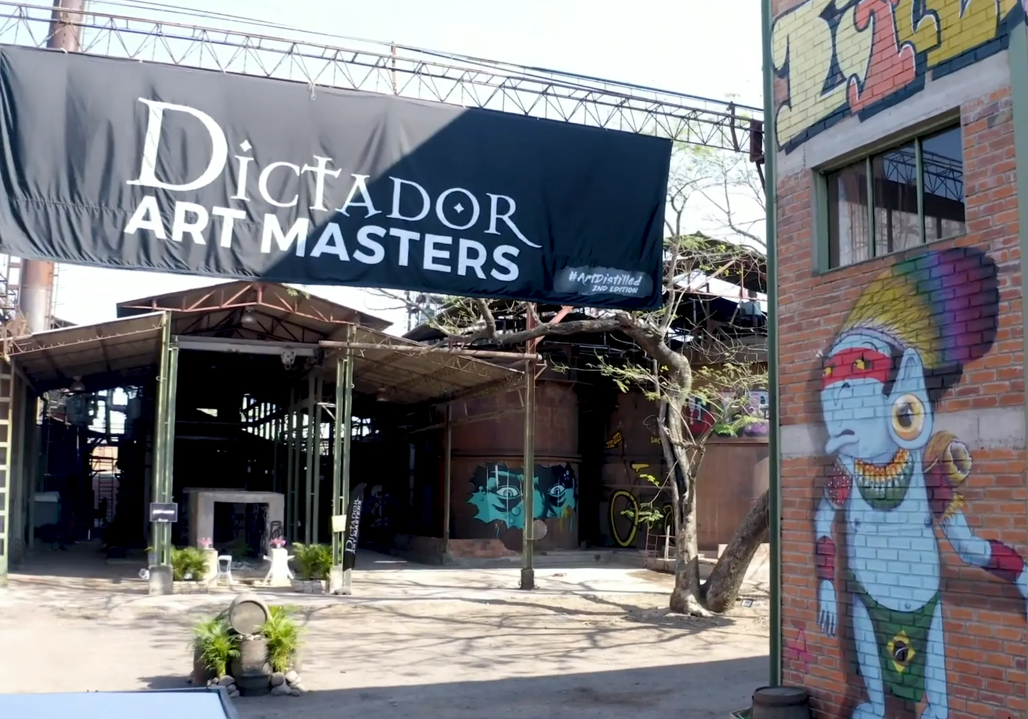 Dictador banner hanging over abandoned distillery.